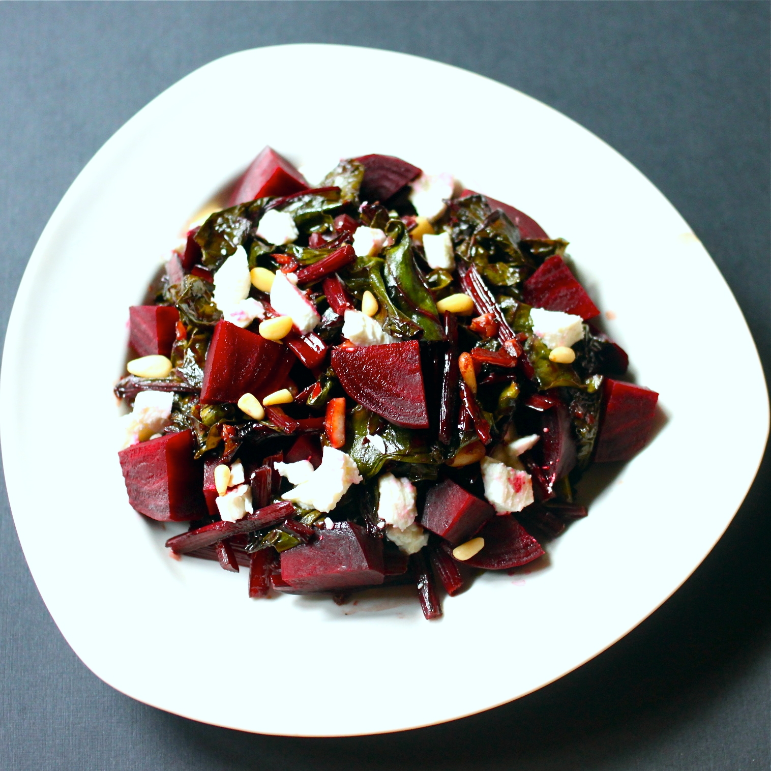 Warm Beet Green Salad with Beets, Goat Cheese, and Pine Nuts